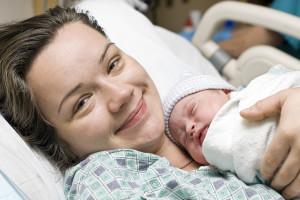 Happy mother with newborn baby